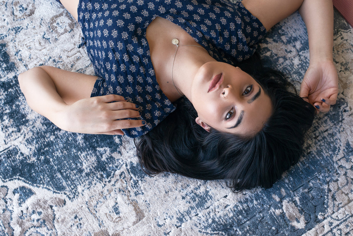 Lady On Rug How to choose the right rug for any room | MacCarthys