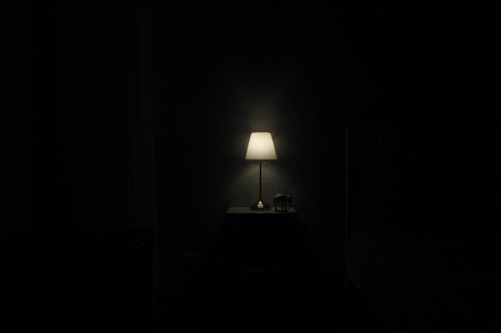 A table lamp in the dark room